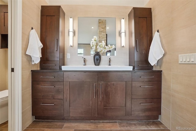 2841 Wyecliff Way, Highlands Ranch, CO 80126 - bathroom featuring vanity and wood finished floors