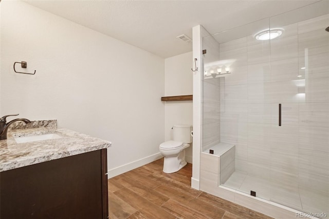 2841 Wyecliff Way, Highlands Ranch, CO 80126 - bathroom featuring vanity, a stall shower, and wood finished floors