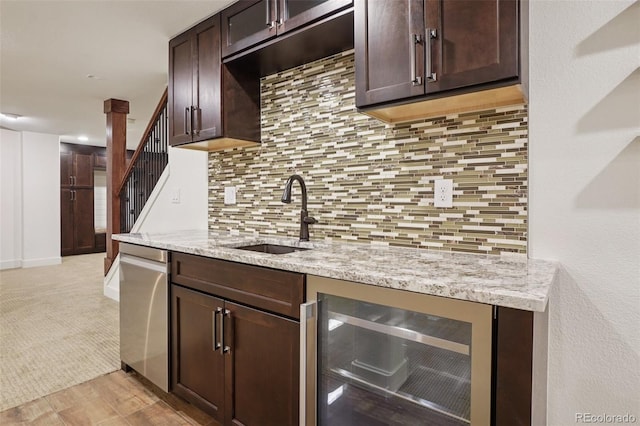 2841 Wyecliff Way, Highlands Ranch, CO 80126 - kitchen featuring beverage cooler, dark brown cabinets, light stone counters, and tasteful backsplash