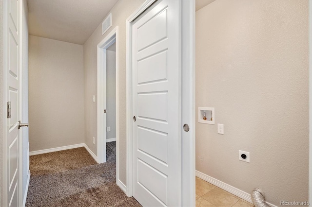 laundry room with hookup for an electric dryer, laundry area, washer hookup, visible vents, and baseboards