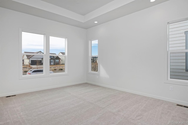 spare room featuring recessed lighting, visible vents, baseboards, and carpet