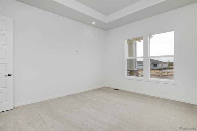 carpeted empty room with visible vents, recessed lighting, and baseboards