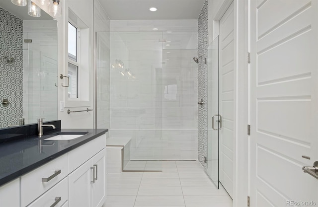 bathroom featuring recessed lighting, a stall shower, vanity, and tile patterned flooring