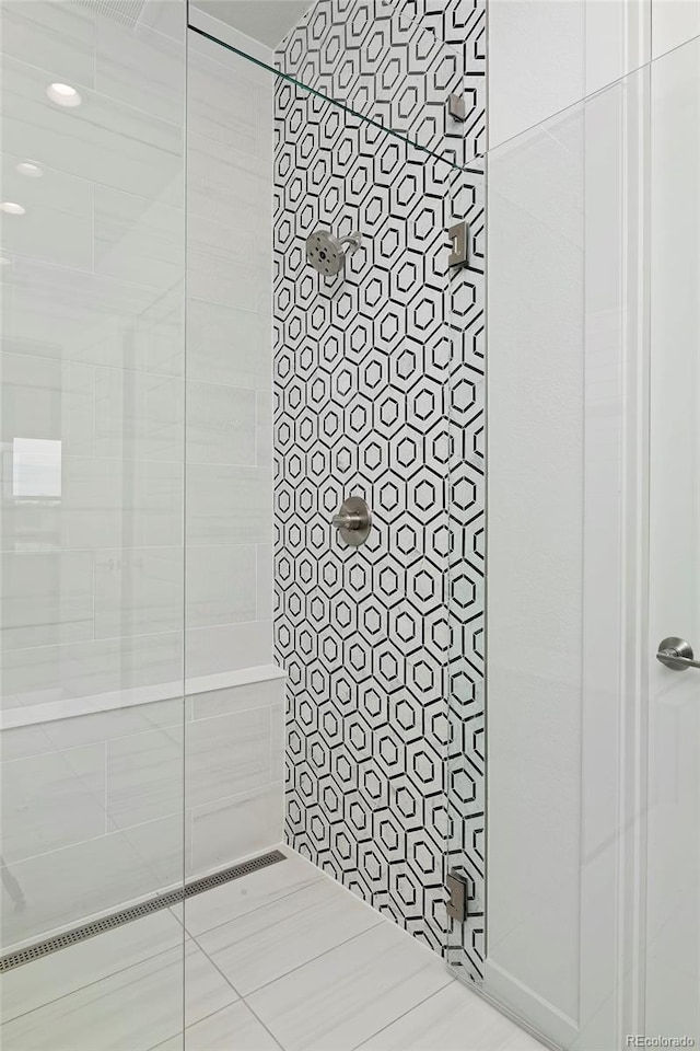 full bathroom with a tile shower