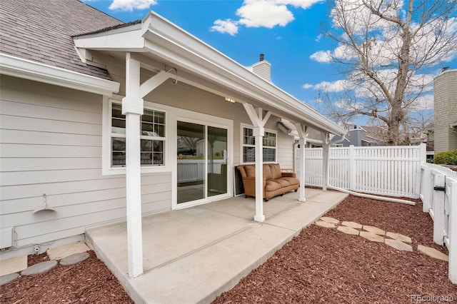 view of patio featuring fence