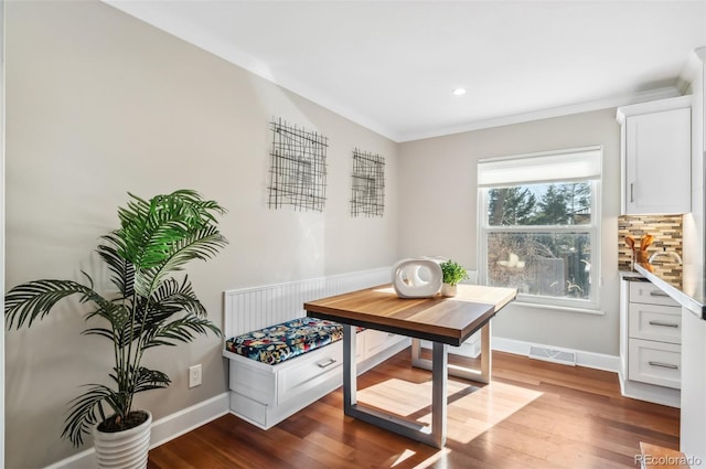 interior space featuring ornamental molding and light hardwood / wood-style floors