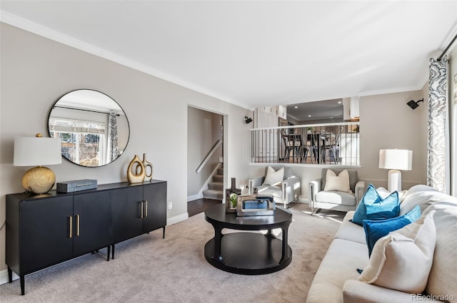 living room with carpet floors and ornamental molding