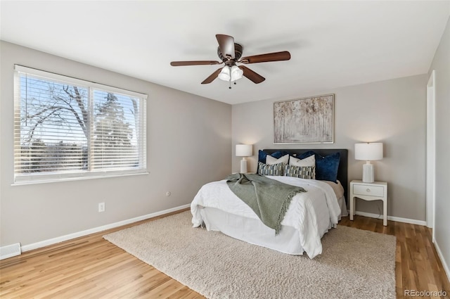 bedroom featuring hardwood / wood-style flooring and ceiling fan