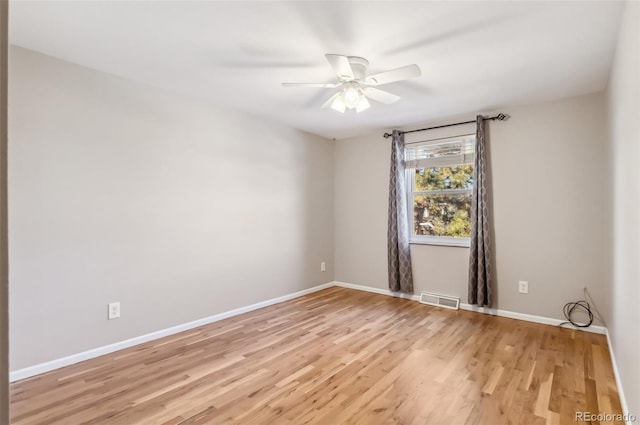 spare room with ceiling fan and light hardwood / wood-style flooring