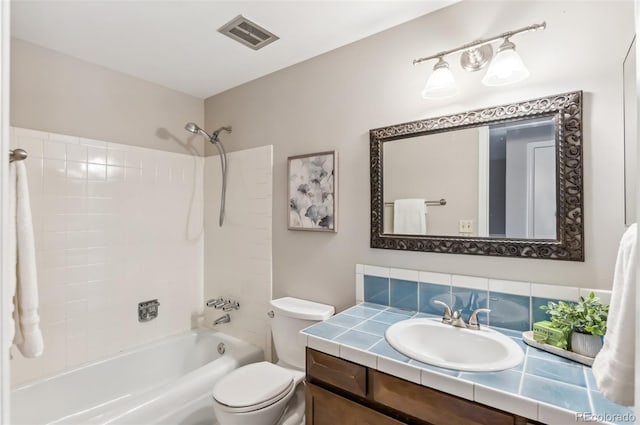 full bathroom with shower / bath combination, vanity, and toilet