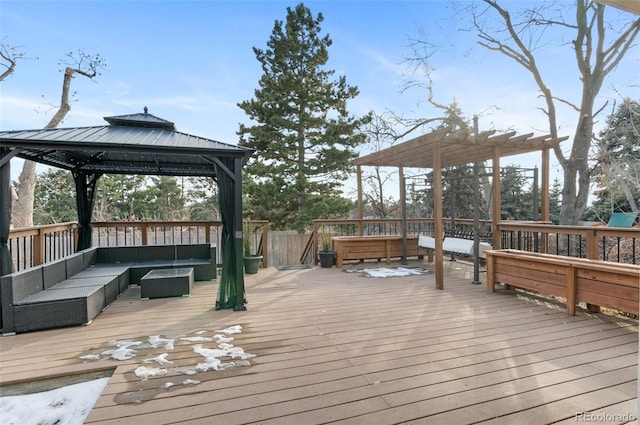 wooden terrace with a gazebo and an outdoor hangout area