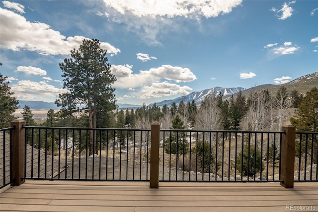 wooden deck with a mountain view