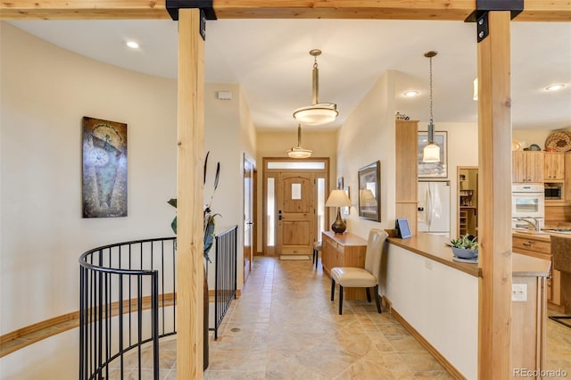 entryway featuring baseboards and recessed lighting