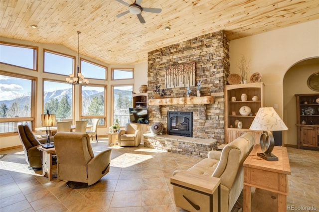 living room featuring wood ceiling, a mountain view, vaulted ceiling, and ceiling fan with notable chandelier