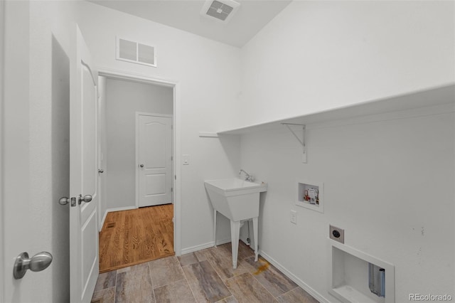 washroom with washer hookup, electric dryer hookup, and sink