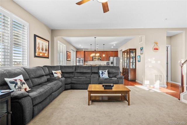 living room featuring baseboards, recessed lighting, visible vents, and a ceiling fan