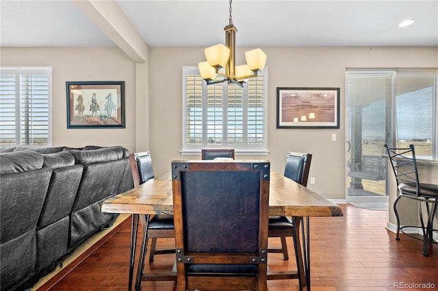 dining room featuring an inviting chandelier, baseboards, dark wood finished floors, and recessed lighting