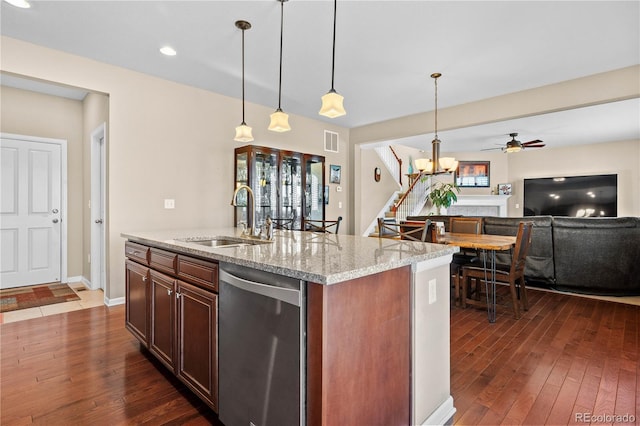 kitchen featuring a sink, visible vents, dark wood-type flooring, and dishwasher