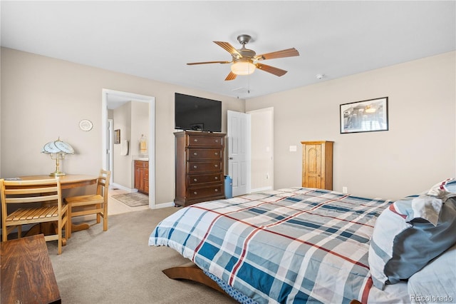 bedroom featuring ceiling fan, baseboards, connected bathroom, and light colored carpet