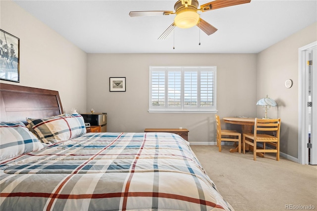 bedroom with carpet, ceiling fan, and baseboards