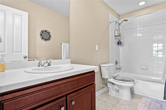 full bathroom with toilet, vanity, shower / tub combination, baseboards, and tile patterned floors