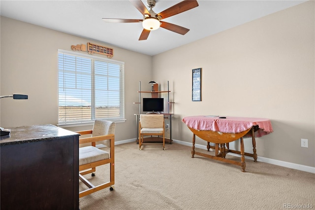 office featuring carpet flooring, ceiling fan, and baseboards