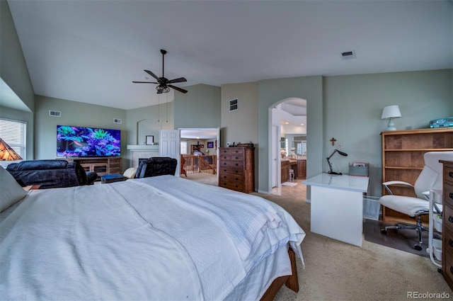 carpeted bedroom featuring lofted ceiling and ceiling fan