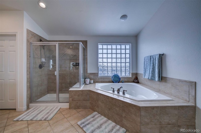 bathroom featuring tile patterned flooring, vaulted ceiling, and independent shower and bath