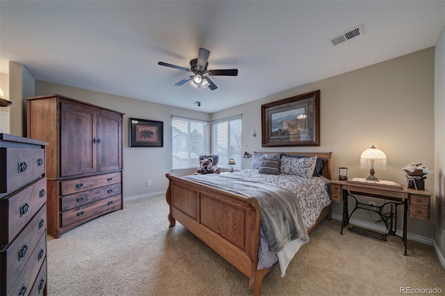 bedroom with light carpet and ceiling fan