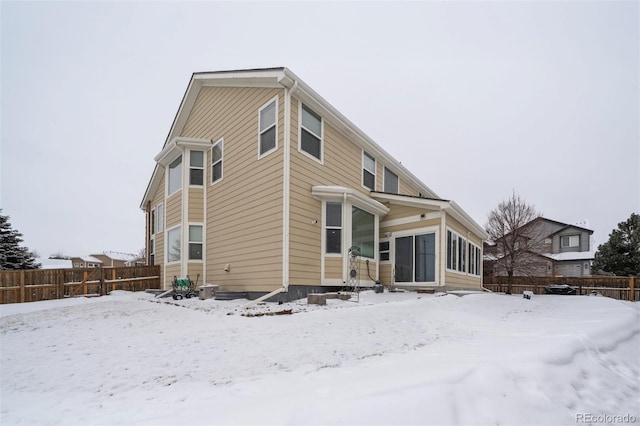 view of snow covered house