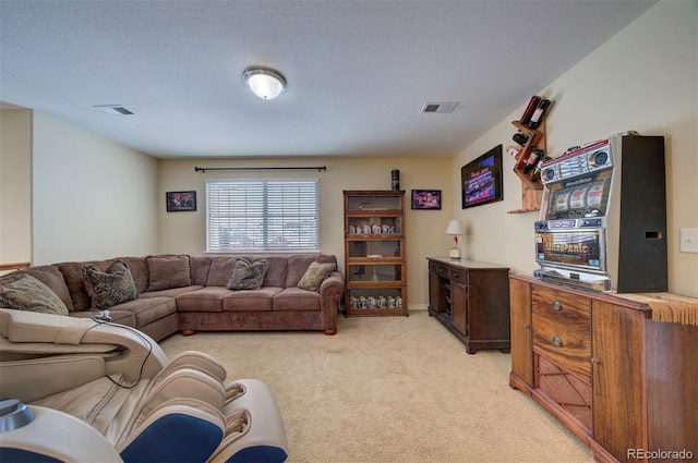 living room with light colored carpet and a textured ceiling