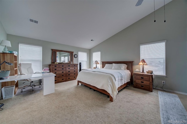 carpeted bedroom with high vaulted ceiling and ceiling fan