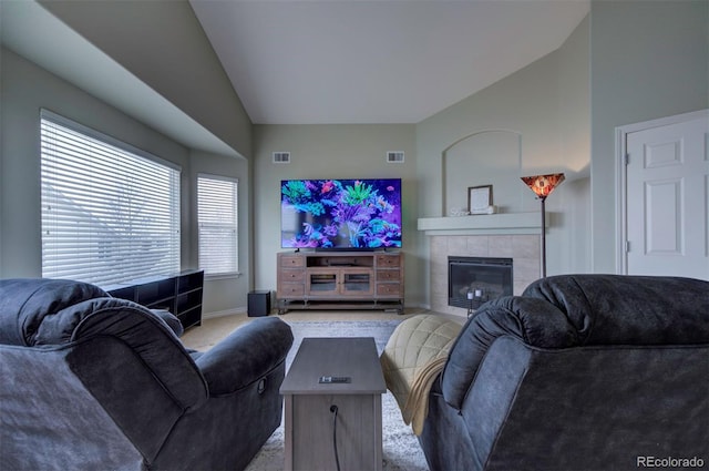 living room with lofted ceiling, carpet floors, and a fireplace