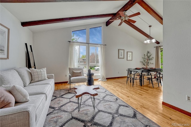 living area featuring plenty of natural light, light wood-type flooring, and ceiling fan