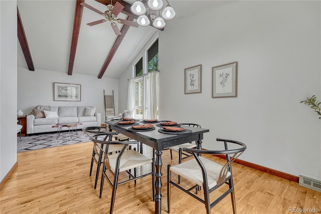 dining room with ceiling fan, baseboards, and light wood-style floors