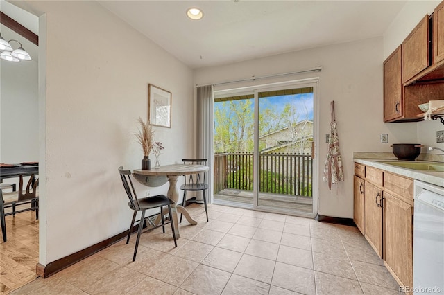 dining space with recessed lighting, baseboards, and light tile patterned floors