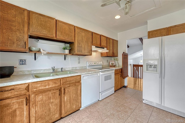 kitchen featuring white appliances, under cabinet range hood, a sink, open shelves, and light countertops