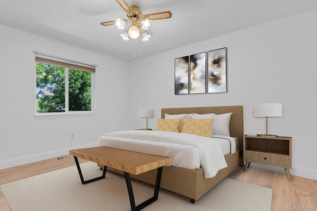 8705 W 86th Dr, Arvada, CO 80005 - bedroom featuring light wood-type flooring and a ceiling fan