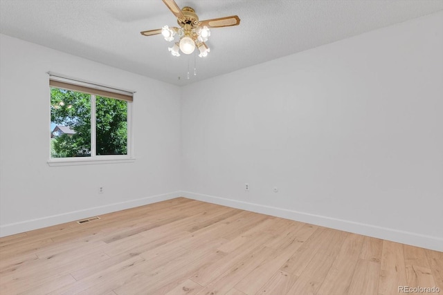 8705 W 86th Dr, Arvada, CO 80005 - spare room with light wood-style flooring, a ceiling fan, and a textured ceiling