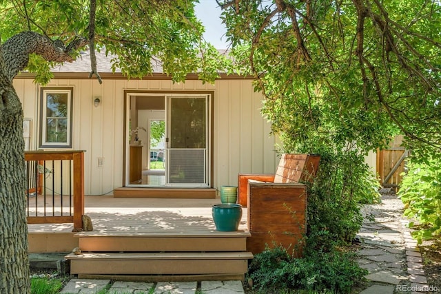 8705 W 86th Dr, Arvada, CO 80005 - view of exterior entry featuring a wooden deck