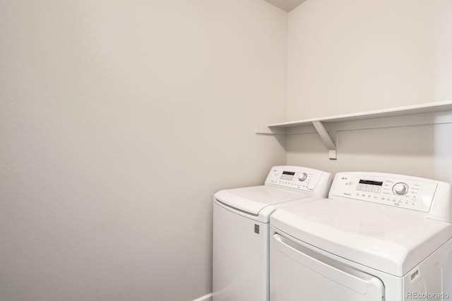 laundry area featuring washing machine and dryer and laundry area