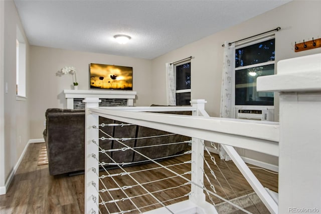 interior space with hardwood / wood-style floors and a textured ceiling