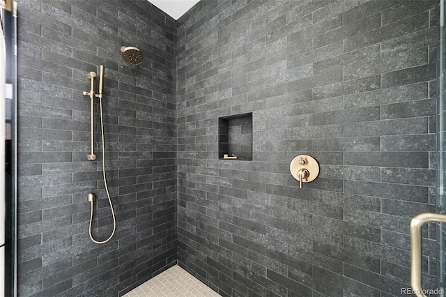 full bathroom with a tile shower