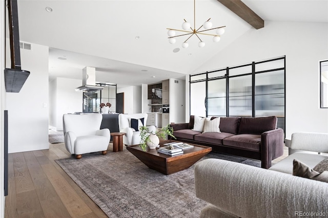 living area with beamed ceiling, high vaulted ceiling, hardwood / wood-style floors, an inviting chandelier, and baseboards