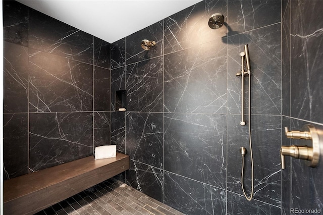 bathroom with tiled shower