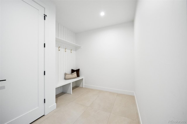 mudroom featuring baseboards and light tile patterned flooring