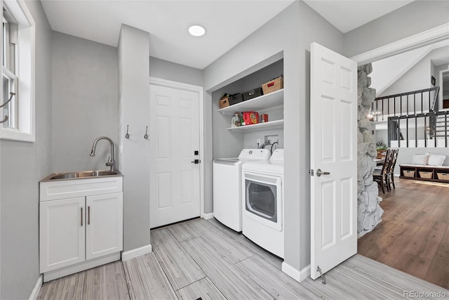 9053 Clydesdale Rd, Castle Rock, CO 80108 - laundry area featuring separate washer and dryer, light wood-type flooring, and baseboards