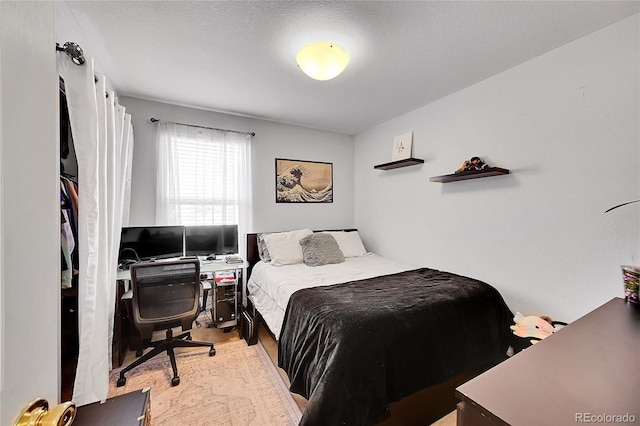 bedroom with wood finished floors