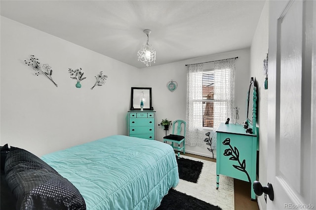 bedroom with a notable chandelier