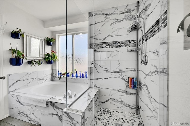 bathroom with a marble finish shower and a bath